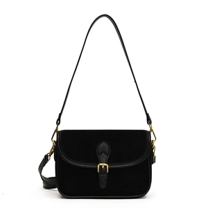 Retro black crossbody bag with matte flap and gold buckle on a white background