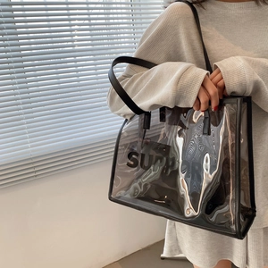 Modern large transparent PVC tote bag with black leather trim and SUPPORT lettering print