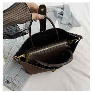 Top view of large coffee tote bag with a removable inner pouch and gold hardware