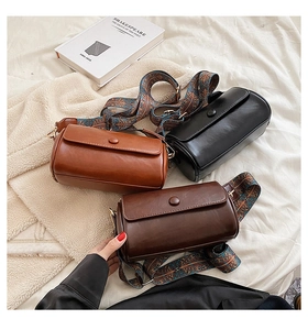 Retro cylinder crossbody bags in three colors featuring vintage geometric pattern wide straps
