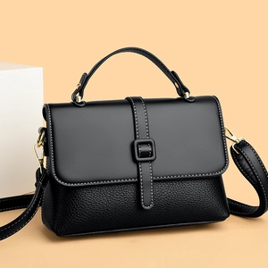 Fashionable black leather crossbody messenger bag with gold hardware and contrast stitching