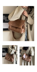 Detail der braunen Vintage-Einkaufstasche mit breitem Schultergurt und goldener Hardware
