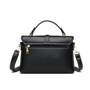 Black pebbled leather messenger bag with top handle and gold hardware for women