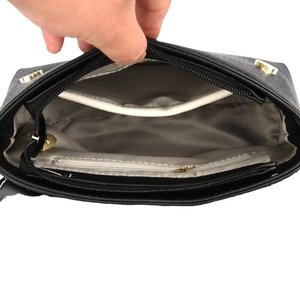 Luxury black leather messenger bag with spacious interior and herringbone fabric lining