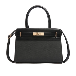 Chic black patchwork crossbody bag with top handle and gold-tone twist lock closure