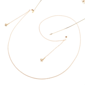 Detail of gold metal eyewear chain with crystal butterfly pendants and non-slip rubber loops