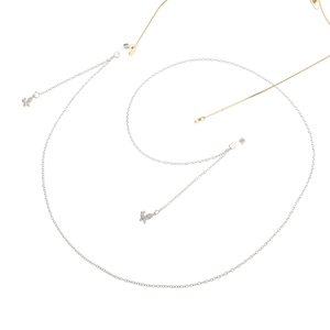Detailed view of silver eyewear chain with sparkling zircon butterfly charms and non-slip grips
