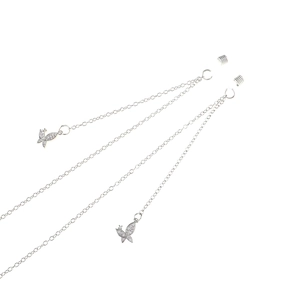 Macro detail of silver eyeglass chain featuring zircon butterfly pendants and metal clips