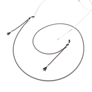 Minimalist black eyewear chain with small airplane pendants on a clean white background