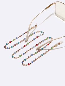 Detail of colorful crystal beads and gold metal spacers on anti-slip eyewear chain strap