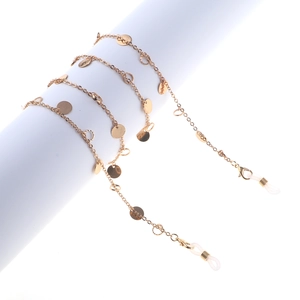 Minimalist gold link eyeglass chain with circular disc charms and secure silicone ends
