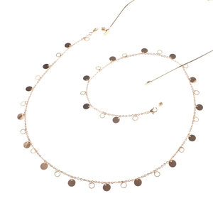Elegant gold glasses chain with polished metal discs and adjustable silicone ends