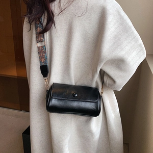 Chic black cylinder crossbody bag with colorful bohemian wide shoulder strap for women
