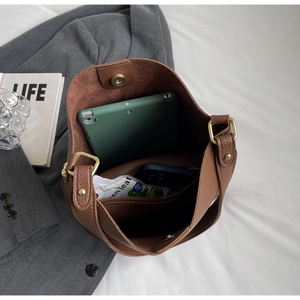 Top view of brown lychee grain tote bag showing spacious interior with iPad and phone
