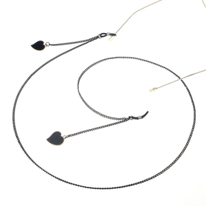 Fashionable black eyewear chain with heart pendants and adjustable rubber loops