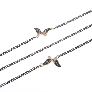 Non-slip metal eyewear chain featuring black rhinestone butterfly pendants on dark link cord