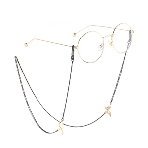 Black metal eyewear chain with golden rhinestone butterfly charms on round glasses