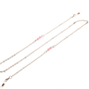 Elegant gold metal eyeglasses chain featuring pink pearls and anti-slip silicone loops