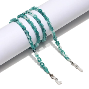 Detail of teal marble acrylic eyewear chain with lobster clasp and silicone loop