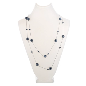 Macro view of dual-use grey beaded sweater chain with faceted crystal stones and thin lines