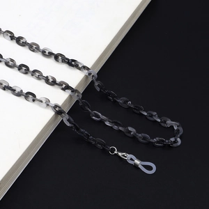 Close-up of marbled resin glasses chain with metal lobster clasp and silicone loops