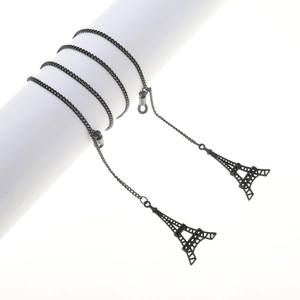 Sleek black metal eyewear chain featuring minimalist Eiffel Tower charms and silicone loops