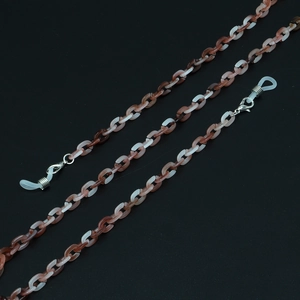 Detail of tortoise shell acrylic eyewear chain with lobster clasps and silicone loops