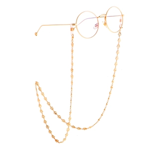 Golden hollow crown link eyewear chain with slim round frame glasses on white background