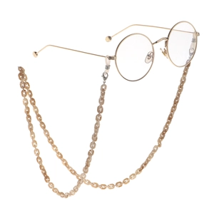 Retro round gold metal glasses with amber tortoiseshell acrylic chain on white background