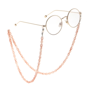 Pink translucent acrylic eyeglass chain with gold metal round frame glasses
