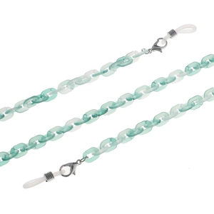 Detail view of light green and matte white acrylic eyeglass chain with secure silicone loops