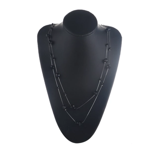 Double-layered necklace with black faceted crystal beads on silver metal chains