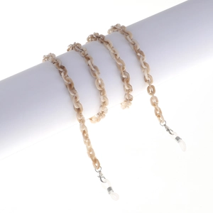 Cream acrylic glasses chain with marble texture and silicone loops on white background
