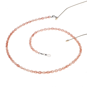 Detailed view of pink translucent resin glasses chain with silver metal clasps and silicone loops