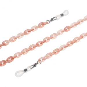 Detailed view of pink acrylic eyewear chain with lobster clasps and silicone loops