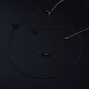 Minimalist black metal eyewear chain with butterfly charms and silicone loops