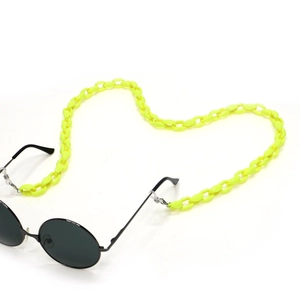 Macro view of neon yellow acrylic glasses chain with silicone anti-slip loop connectors