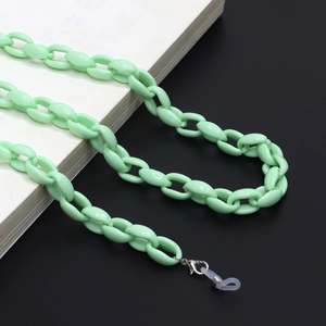 Detail of mint green acrylic eyeglass chain with silver lobster clasp and silicone loop