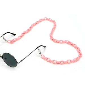 Detail of bright pink acrylic eyeglass chain with vintage black round sunglasses
