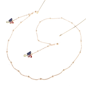 Detail view of golden eyewear chain with American flag butterfly charms and silicone loops