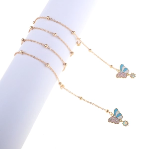 Detail of rose gold butterfly eyeglass chain with blue enamel and colorful crystal beads