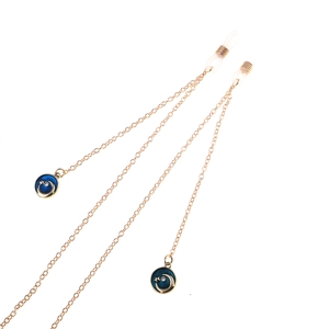 Golden eyewear chain with blue star and moon charms and non-slip silicone loops