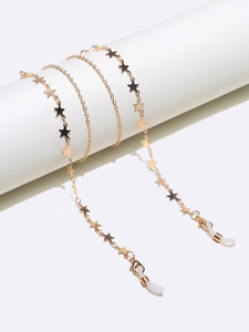 Detail of gold star glasses chain with lobster clasp and white silicone loops