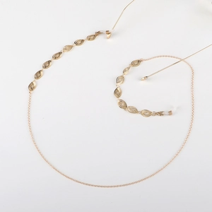 Light gold fashion eyewear chain featuring hollow leaf charms and non-slip silicone loops