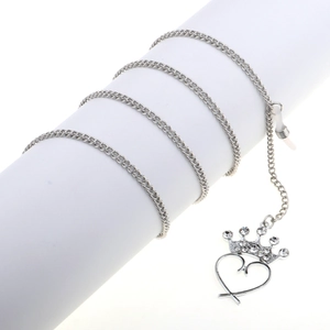 Silver metal eyewear chain featuring crystal heart crown pendants and rubber loops