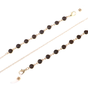 Golden eyewear chain featuring black decorative beads and white anti-slip silicone loops