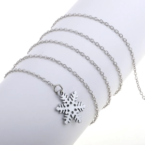 Silver snowflake pendant necklace with delicate metal chain for a minimalist elegant style