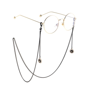 Golden round glasses with black metal neck chain featuring crown pearl pendants