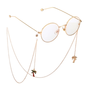 Lunettes rondes dorées avec chaînes antidérapantes à pendentif palmier sur fond blanc