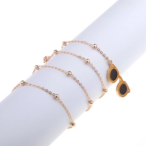 Fashionable gold beaded eyewear chain featuring a creative sunglasses charm pendant